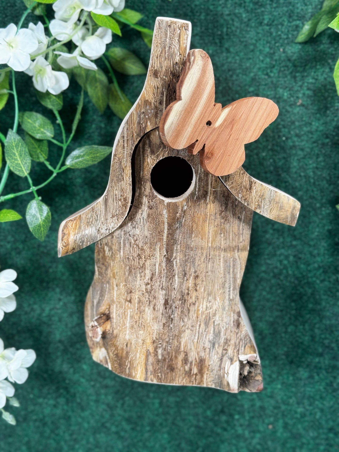 Heres a picture of our birdhomes with a handcrafted butterfly on it.