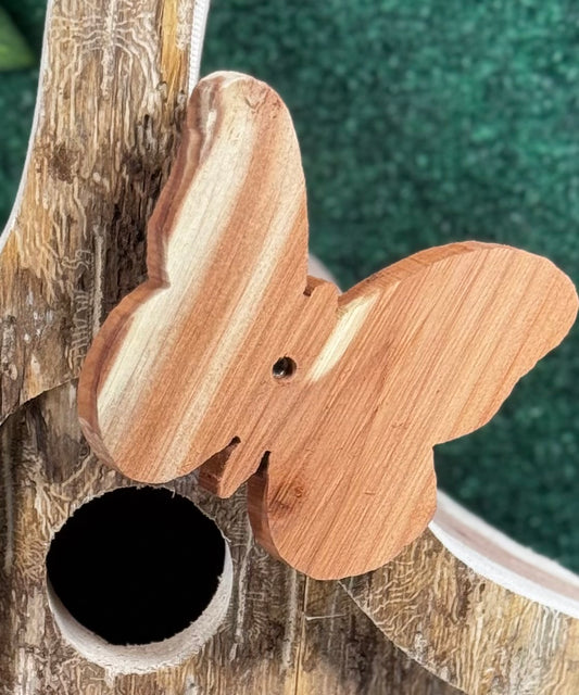Heres a picture of our birdhomes with a handcrafted butterfly on it.